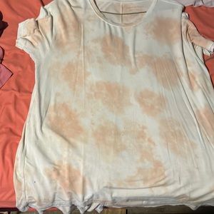 a light pink and peach shirt.